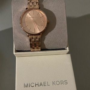 Michael Kors rose gold womens watch brand new. original price $195.00.